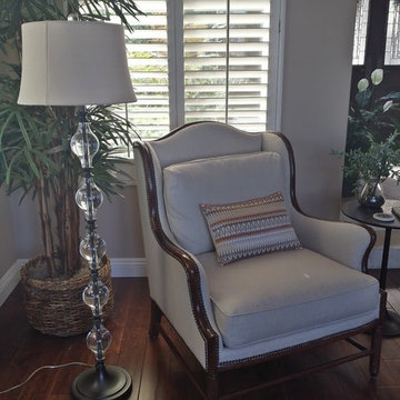 Wood trim wing chair with espresso nailhead detail