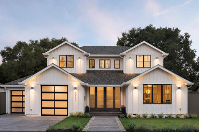 Large farmhouse white two-story concrete fiberboard exterior home photo in San Francisco with a shingle roof