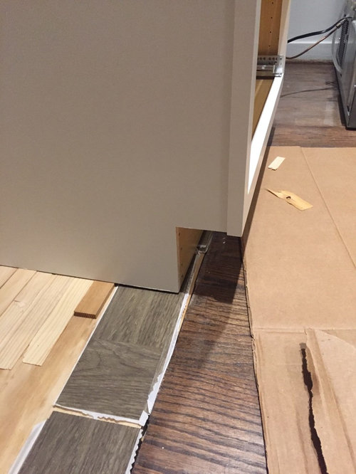 Flooring Doesn T Go To The Edge Of New, Should Laminate Flooring Be Installed Under Cabinets