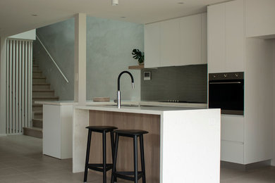 This is an example of a medium sized contemporary kitchen in Sydney.