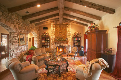 Example of a tuscan family room design in Austin