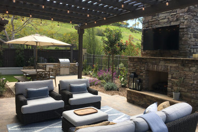 Patio - mid-sized rustic backyard patio idea in San Diego