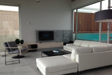 Example of a beach style living room design in Other