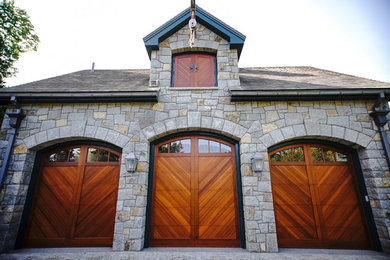 Carport - large traditional detached three-car carport idea in Boston
