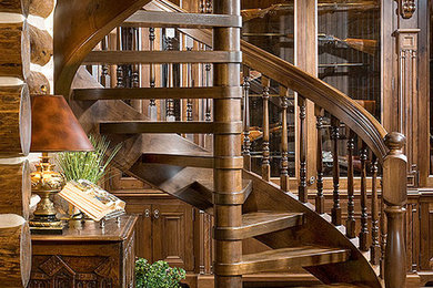 Inspiration for a mid-sized traditional wood spiral staircase in Other with open risers.