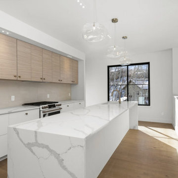 Cloud Pendants over Kitchen Island in Modern Home