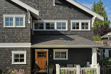 This is an example of a traditional three-storey brown exterior in Seattle with wood siding.