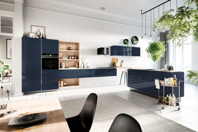 This is an example of a mid-sized modern single-wall eat-in kitchen in Calgary with a single-bowl sink, flat-panel cabinets, blue cabinets, quartzite benchtops, black appliances, light hardwood floors, with island, white floor and white benchtop.