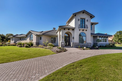 Example of a tuscan exterior home design in Austin