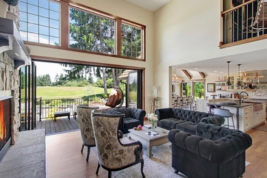 Example of a transitional formal and loft-style medium tone wood floor and brown floor living room design in Seattle with beige walls, a standard fireplace and a stone fireplace