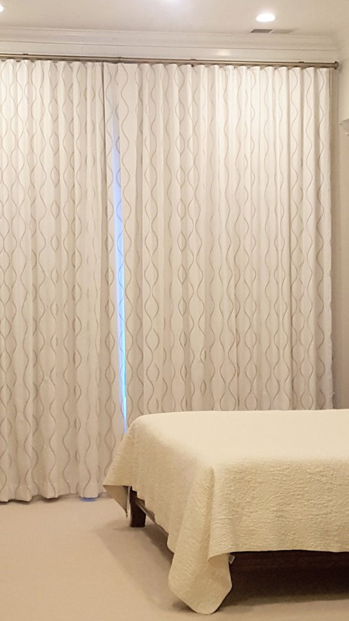 Embroidered drapes with glass hardware