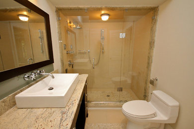 Inspiration for a large master beige tile and stone tile corner shower remodel in Toronto with marble countertops, a one-piece toilet and beige walls