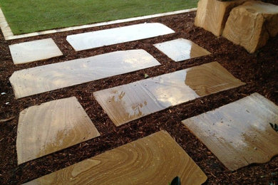 Inspiration for a large backyard full sun formal garden in Brisbane.