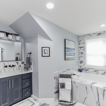 Bathroom remodeling in Columbia, MD with double vanity & marble bathtub