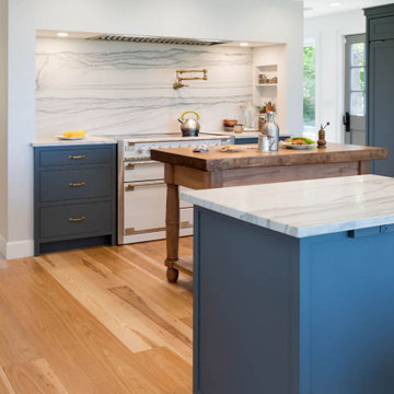 Coastal Kitchen with Marble Island, Induction Range, and Butcher Block Prep Tabl