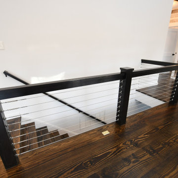 Staircase to lower level of Ranch 30 - Mid-Century Modern Country Ranch