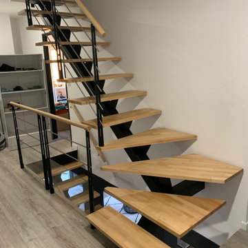 Deux escalier quart tournant l'un sur l'autre dans une trémie rectangulaire