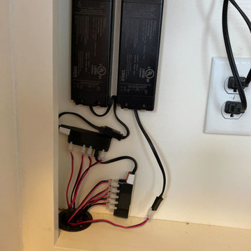 Wired for lighting in a hidden compartment under desk - no unsightly wires