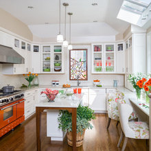 kitchens with orange stove