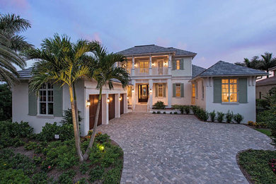 Example of an island style home design design in Miami