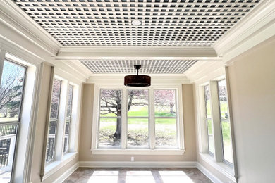 Mid-sized ceramic tile and brown floor sunroom photo in New York