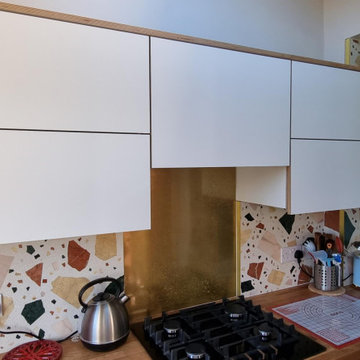 White matt handleless plywood Fenix NTM kitchen.