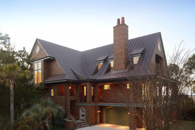 Large traditional two-story wood exterior home idea in Charleston