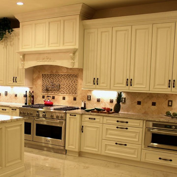 Luxurious Kitchen w/Antique White Cabinetry & Custom Wood Range Hood