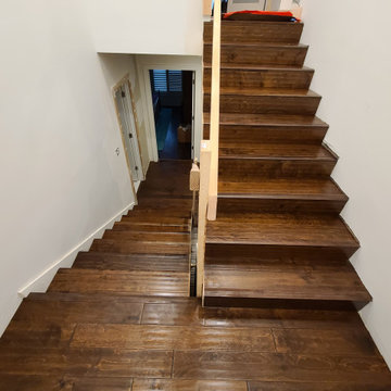 Sleek Engineered Hardwood & Modern Sliding Door by I’m The Man Services