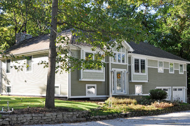 Mid-sized transitional green two-story wood exterior home idea in Chicago with a hip roof