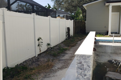 Example of a transitional side yard patio design in Tampa