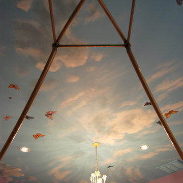 Sky Ceiling Mural with Butterflies, hand-painted in a bedroom by Mural Art LLC.