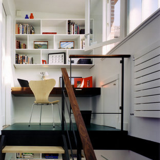 Inspiration for a modern home office and library in New York with white walls.