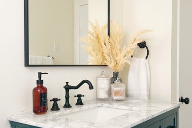 Inspiration for a small timeless white tile and subway tile porcelain tile, white floor, single-sink and wall paneling bathroom remodel in Other with recessed-panel cabinets, turquoise cabinets, a two-piece toilet, white walls, an undermount sink, marble countertops, white countertops and a freestanding vanity