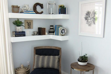 Example of a small trendy vinyl floor entryway design in Miami with blue walls