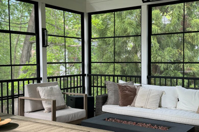 Large back porch idea in DC Metro with a fire pit