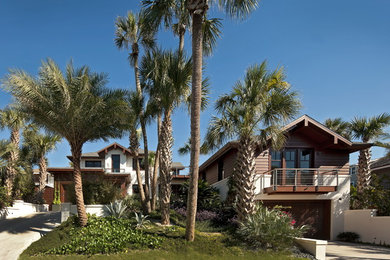 Example of an island style multicolored two-story mixed siding exterior home design in Jacksonville with a shingle roof