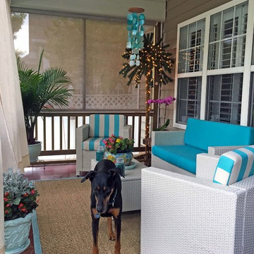 Festive Patio Space Brightened with Sunbrella Turquoise Loveseat and Chair Cushi