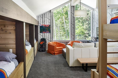 Photo of a beach style gender-neutral kids' bedroom in Denver with grey walls, carpet and grey floor.