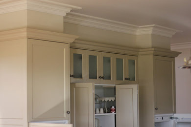 Design ideas for a traditional u-shaped kitchen in Melbourne with recessed-panel cabinets, beige cabinets and with island.