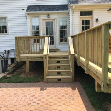 Pressure treated wood stairs with riser lights