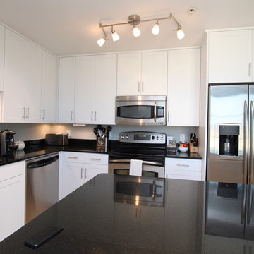 White Contemporary Kitchen with Brushed Nickel Hardware and Black Granite in DC