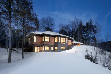 Example of a mountain style exterior home design in Portland Maine