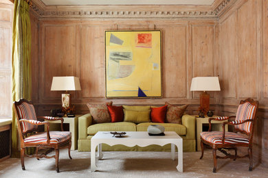 Example of a mid-sized transitional formal and enclosed carpeted and beige floor living room design in London with a corner fireplace, a plaster fireplace and no tv