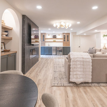Warm & Inviting Basement Retreat with Custom Bar + Entertainment Center