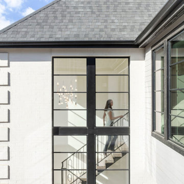 French Modern Spec Home-Juliet balcony with stair view