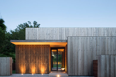 Inspiration for a mid-sized front door remodel in New York with a glass front door