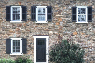 Mid-sized elegant entryway photo in Philadelphia with a black front door