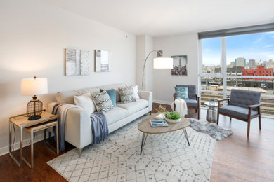 Living room - mid-sized mid-century modern open concept medium tone wood floor and brown floor living room idea in San Francisco with white walls