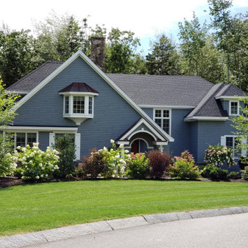 An extensive landscape project with stonewalls, patio, dry river bed & more